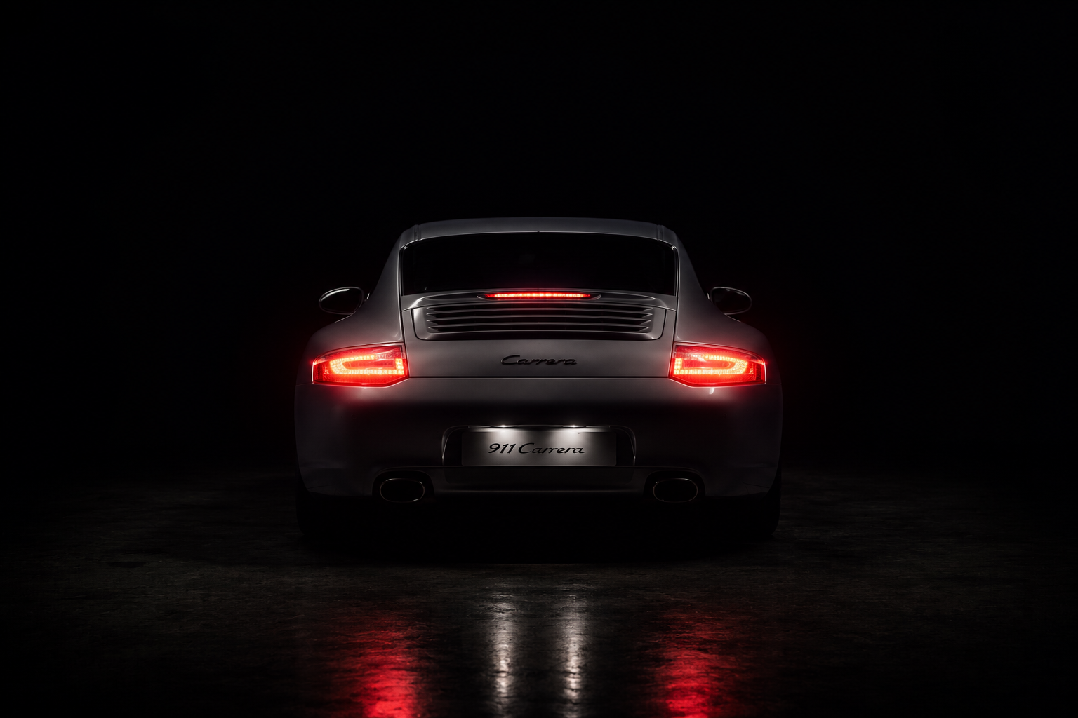 Porsche 911 996 GT2 rear view showing the wing and brake lights active